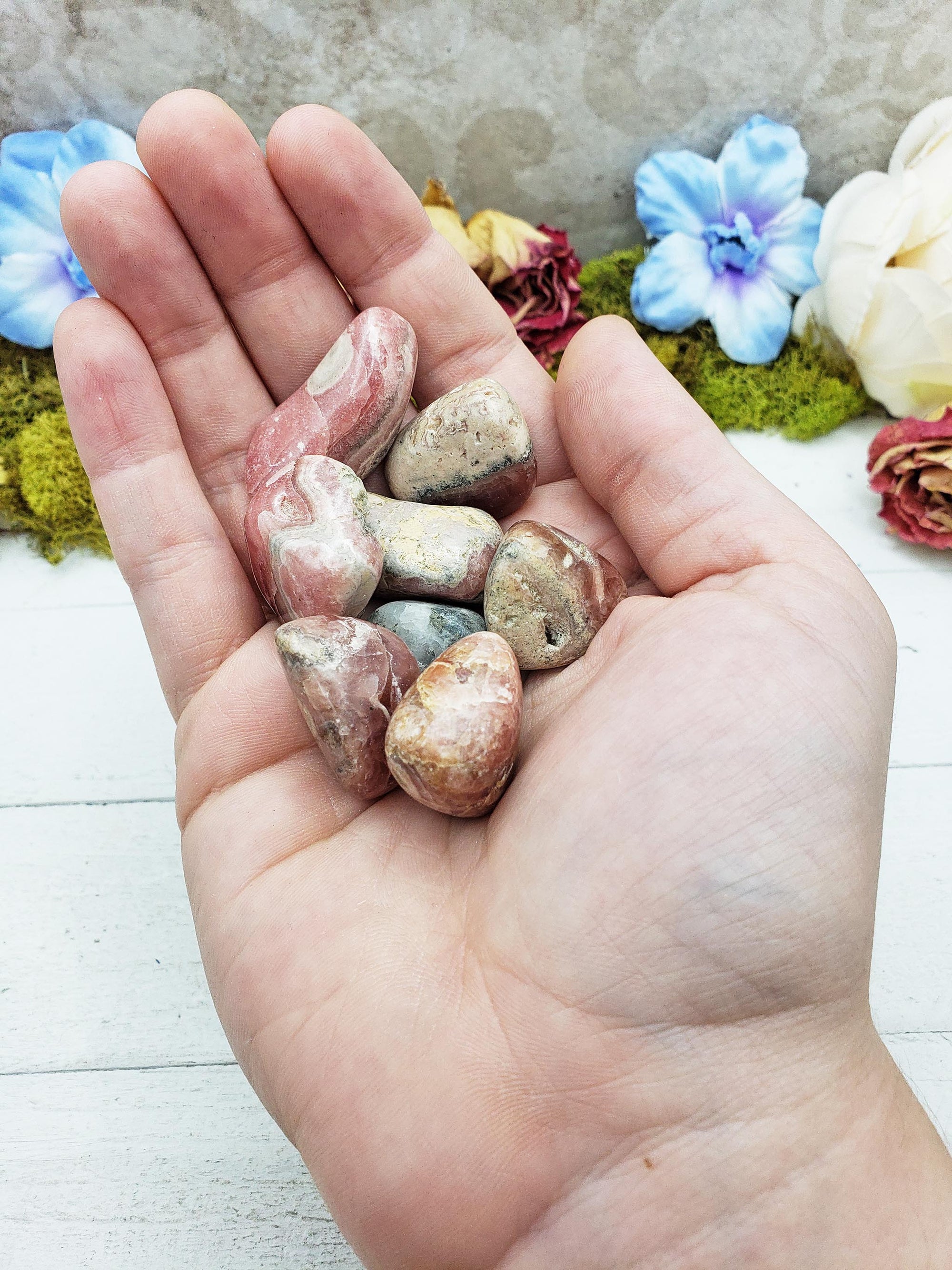 rhodocrosite crystals in hand