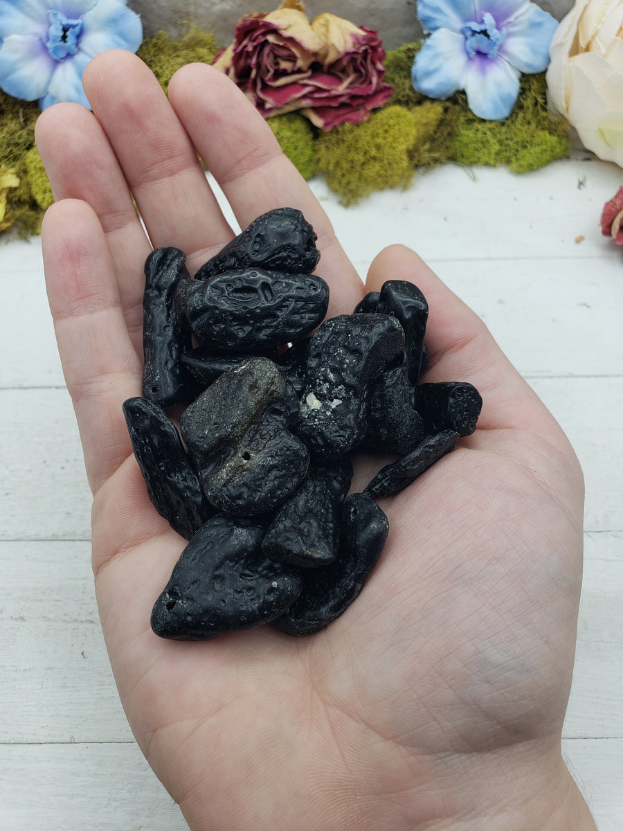 tektite stones in hand
