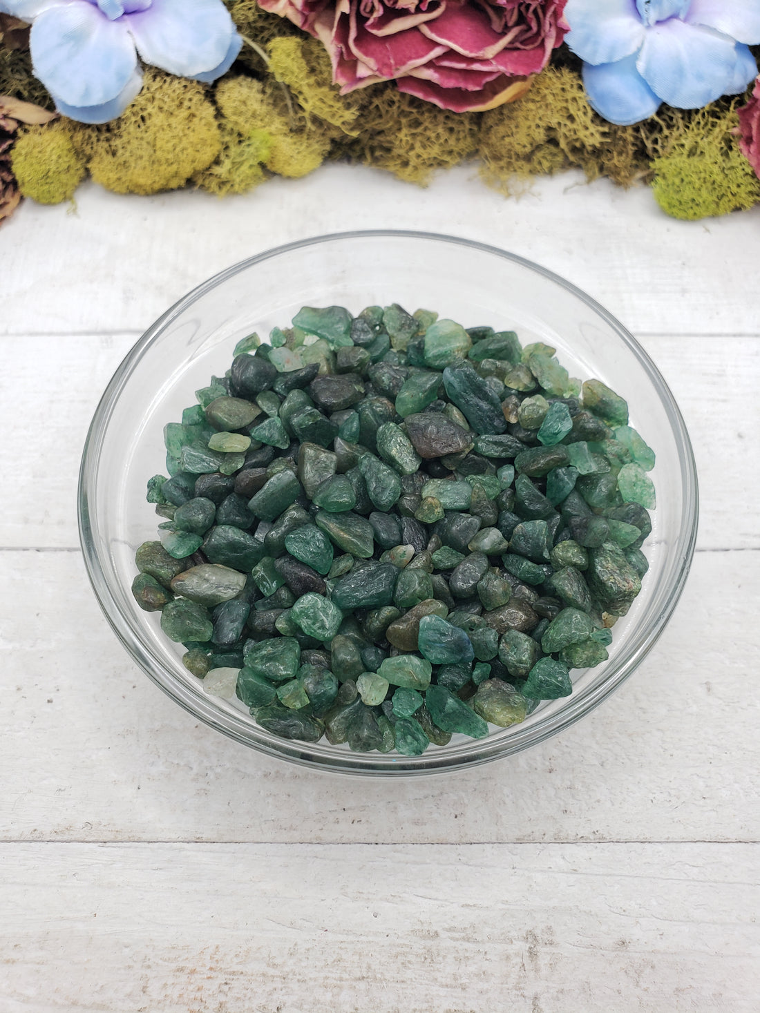 emerald crystal chips in glass bowl