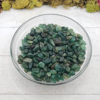 emerald crystal chips in glass bowl