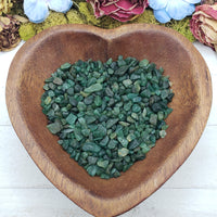 emerald crystal chips in heart-shaped bowl