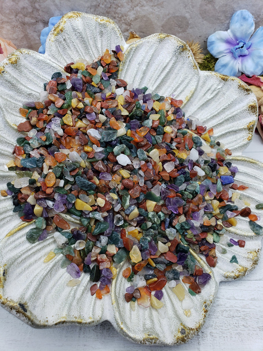 Seven ounces of mixed gemstone crystal chips on floral dish display