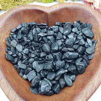 eight ounces of black tourmaline in wooden bowl
