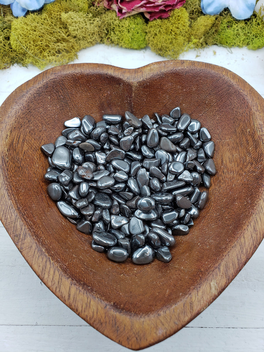 eight ounces of tumbled mini hematite chips in wooden bowl