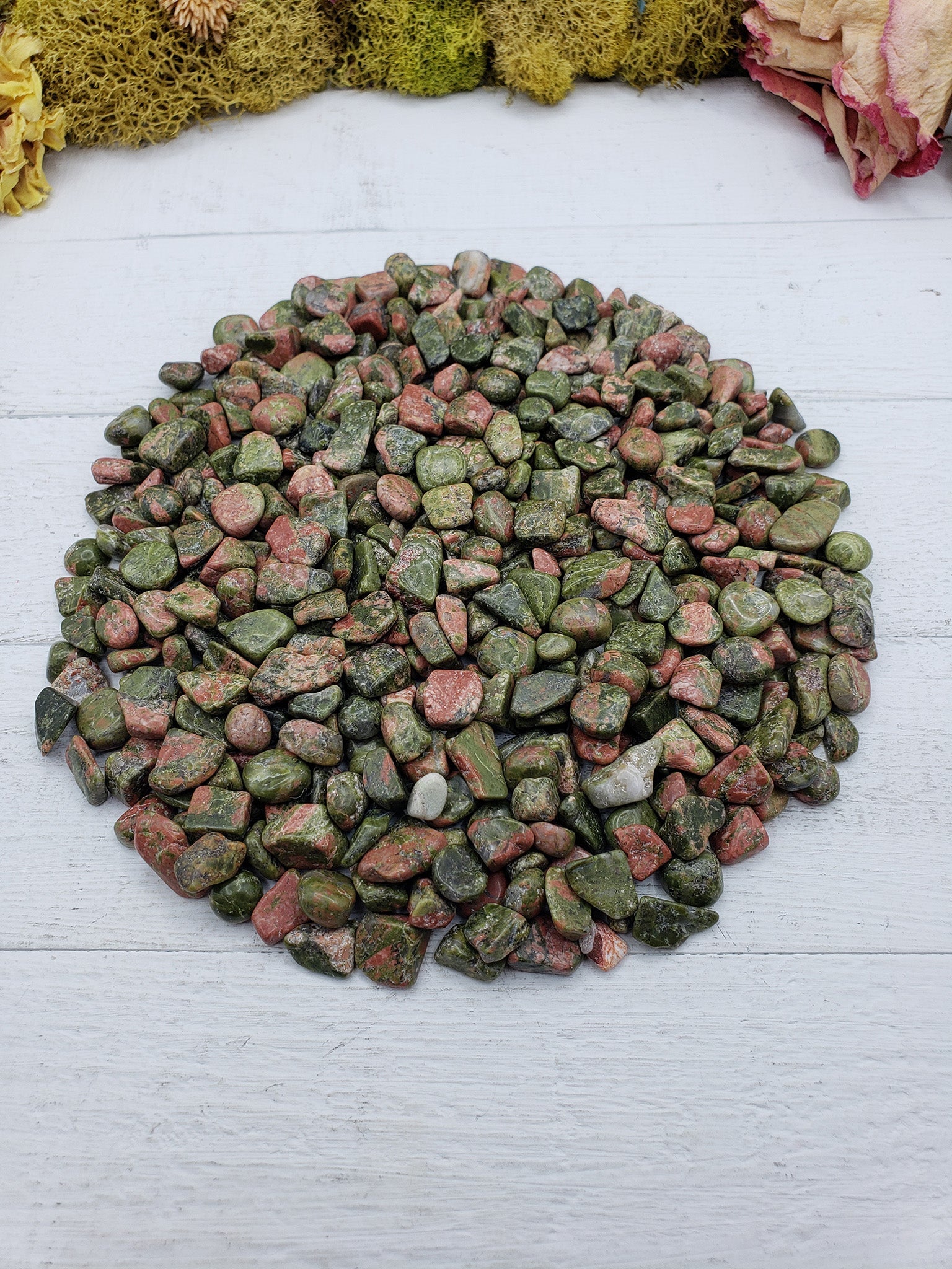 8 ounces of unakite stone chips on display