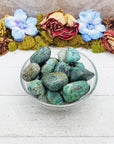 african turquoise stones in glass bowl