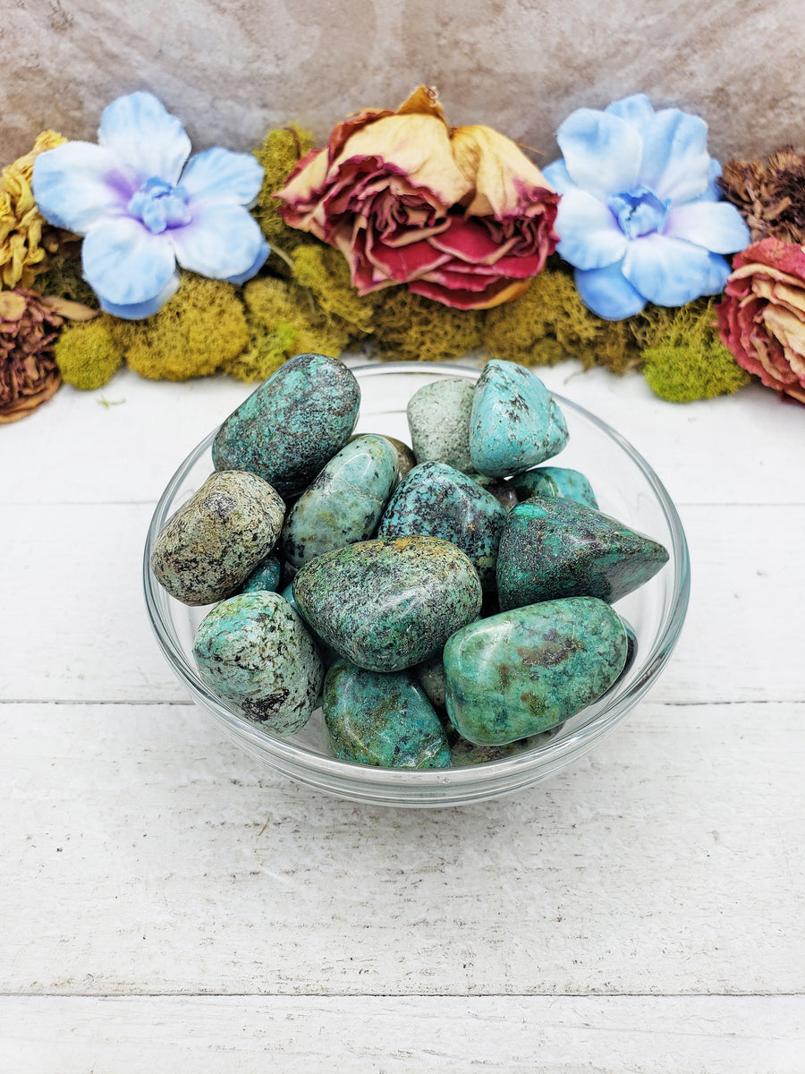 african turquoise stones in glass bowl