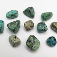 african turquoise stones on white background