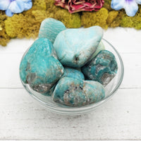 amazonite crystals in glass bowl