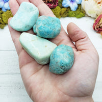amazonite crystals in hand