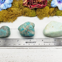 amazonite crystals on ruler
