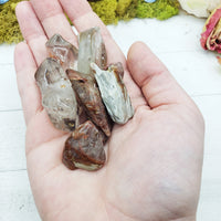 angel phantom quartz stones in hand