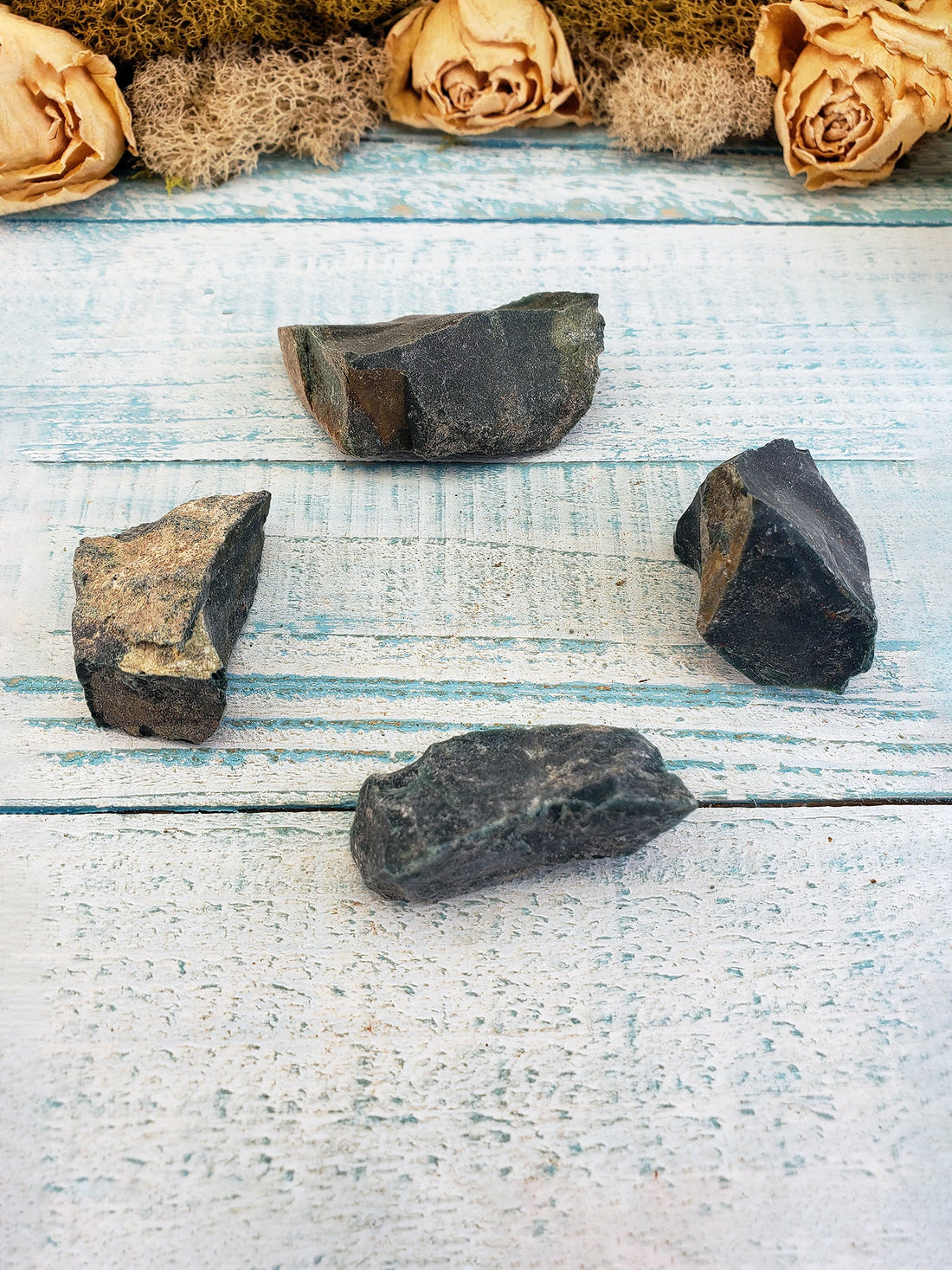 Four rough bloodstone crystal chunks on display