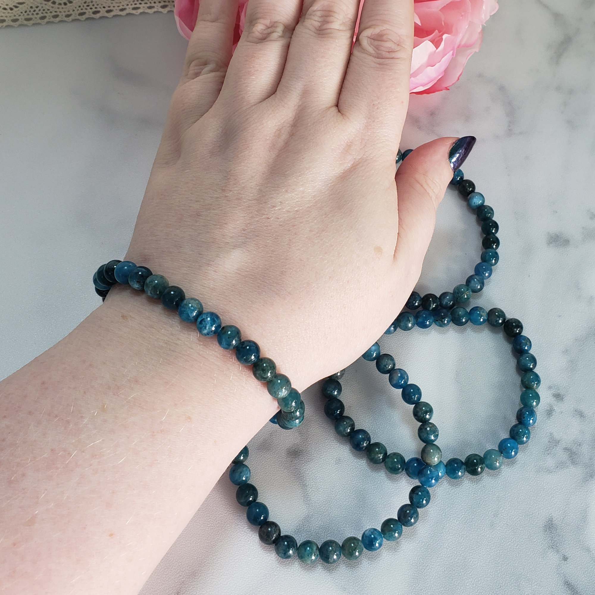 Blue Apatite Crystal Natural Gemstone 6mm Bead Bracelet - On Wrist Above Other Bracelets Natural Crystal Jewelry