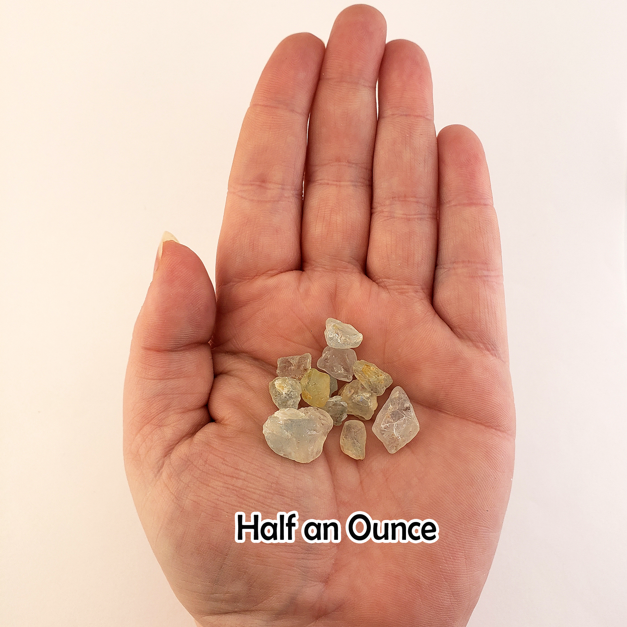 Light Blue Topaz Raw Crystals Rough Gemstones by the Half Ounce - Half Ounce in Hand