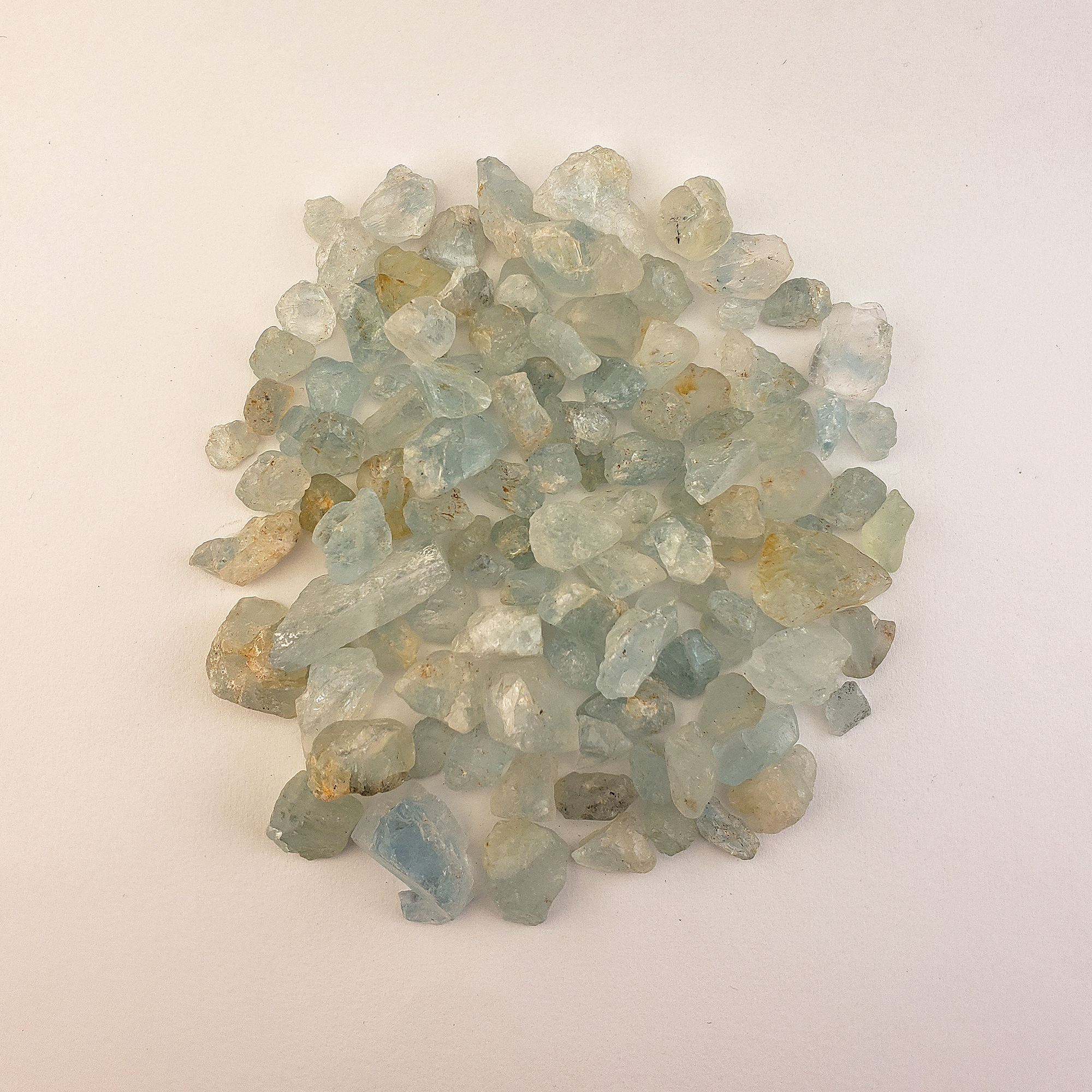 Light Blue Topaz Raw Crystals Rough Gemstones by the Half Ounce - White Background