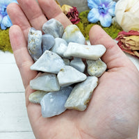 tumbled blue chalcedony in hand