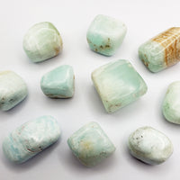 blue ocean caribbean calcite stones on white background