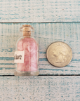 Rose Quartz Crystal Chips Chips in Glass Bottle | Color Enhanced