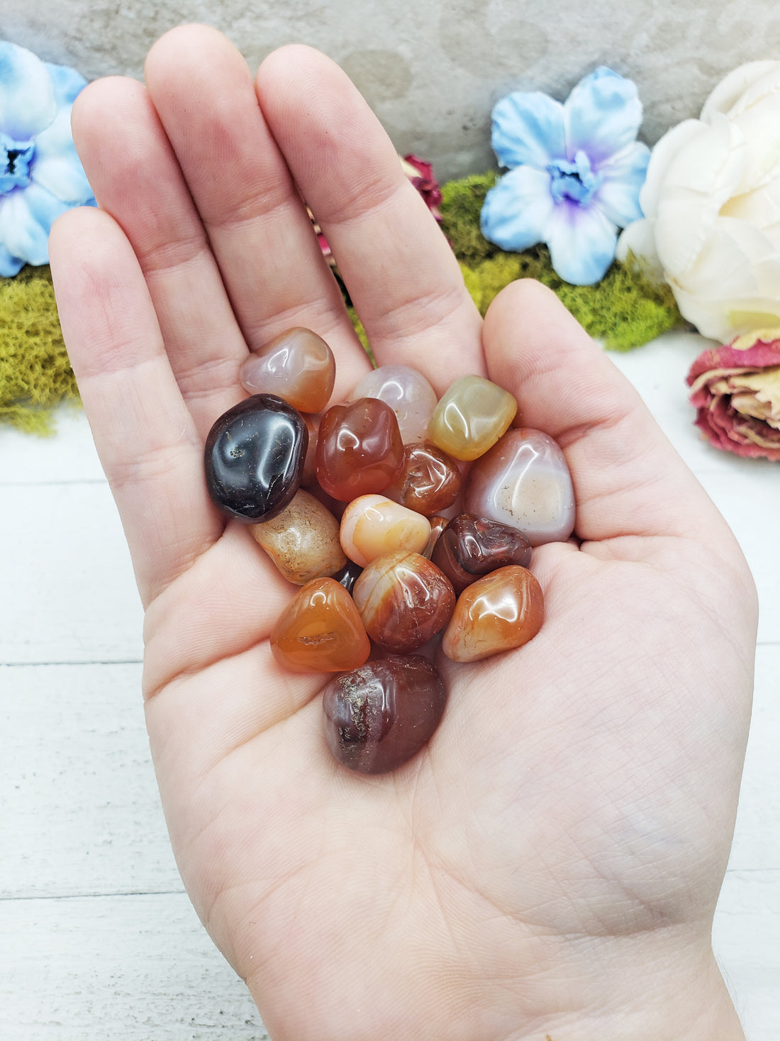 mini carnelian stones in hand