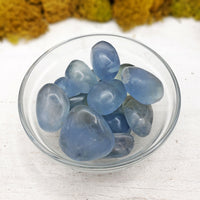 celestite stones in glass bowl