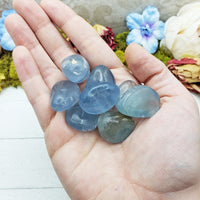 celestite stones in hand