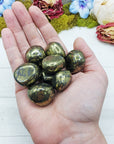 chalcopyrite stones in hand