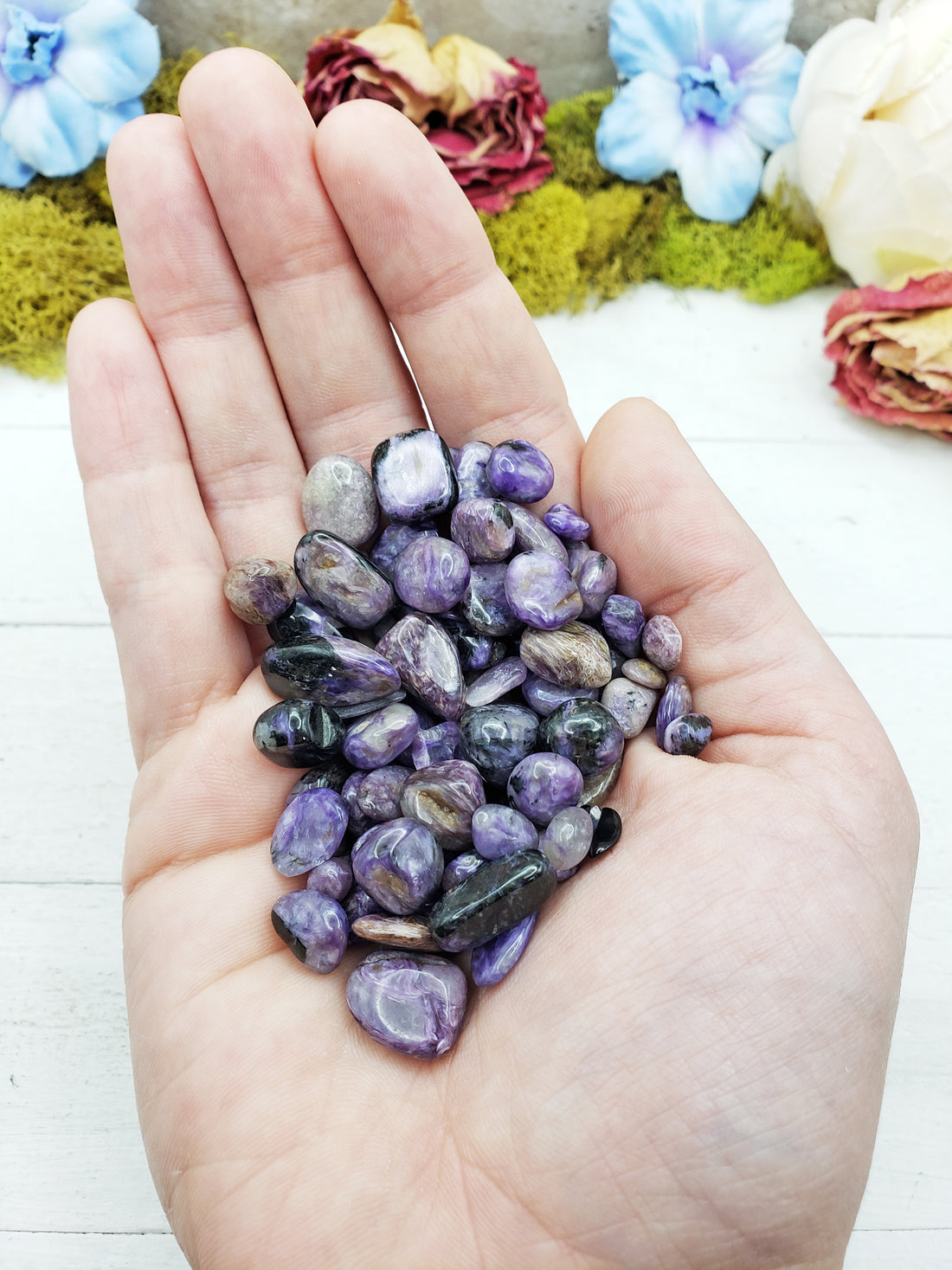charoite stones in hand