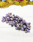 charoite stones on board