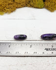 charoite stones by ruler