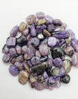 charoite stones on white background