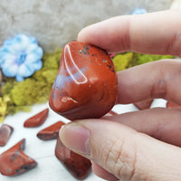 chestnut jasper crystal between fingers