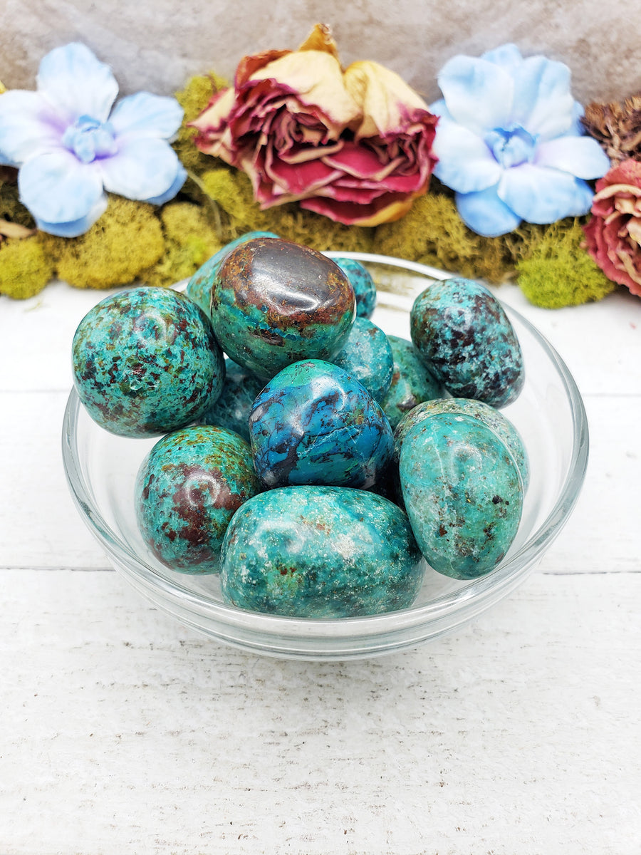 chrysocolla stones in glass bowl