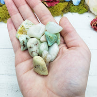 chrysoprase stones in hand