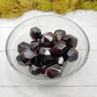garnet crystal pieces in bowl