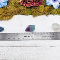 rough fluorite stones by ruler
