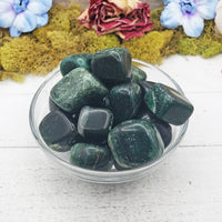 fuchsite crystals in glass bowl