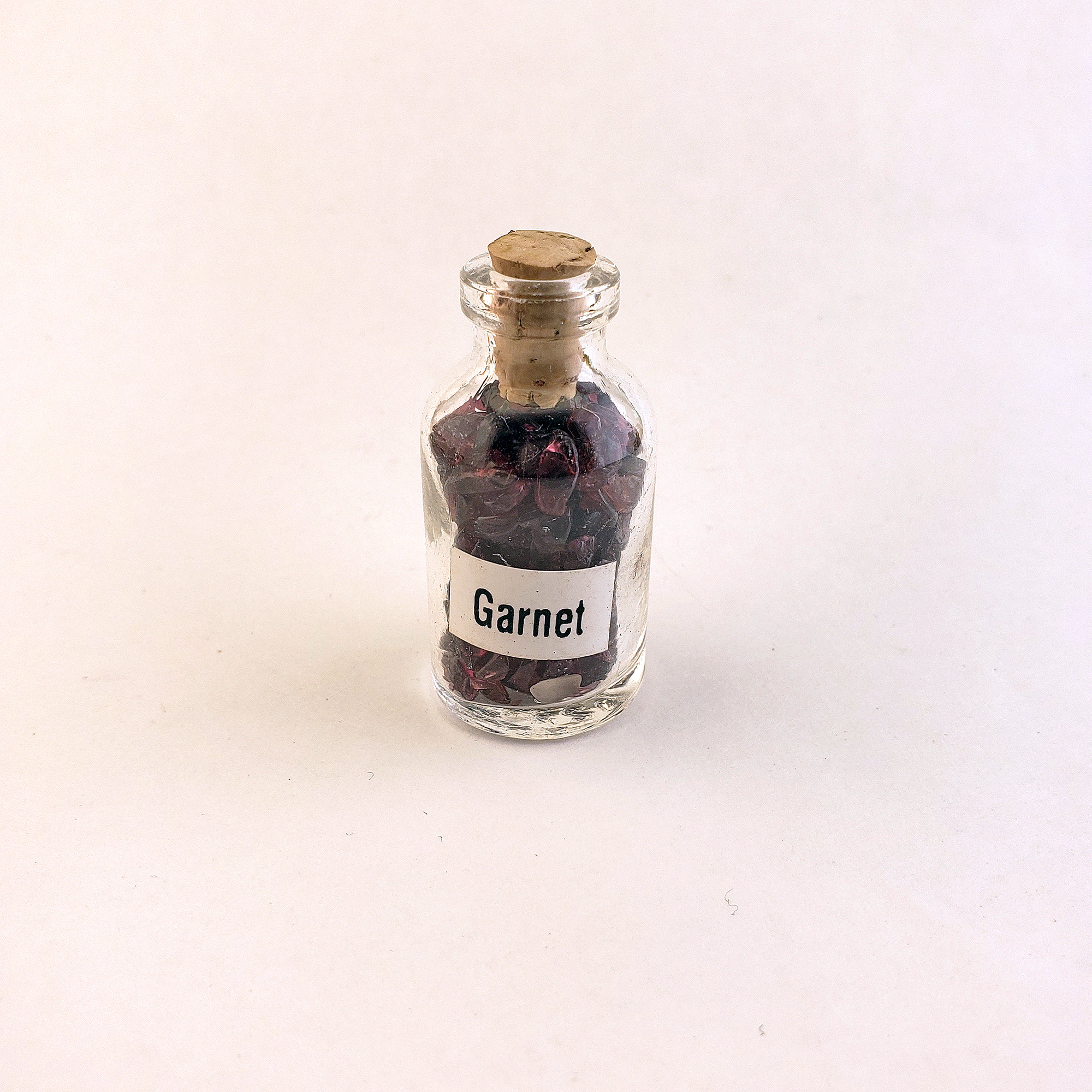 Garnet Natural Crystal Chips Bottle - One Bottle - On White Background