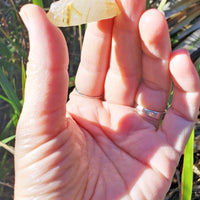 Gold Rutile Quartz Stone in hand