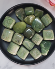 Grossularite | Green Grossular Garnet Crystal Natural Tumbled Stone | Multiple Sizes - In Black Ceramic Bowl