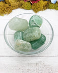 green included quartz crystals in glass bowl