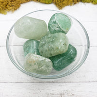 green included quartz crystals in glass bowl