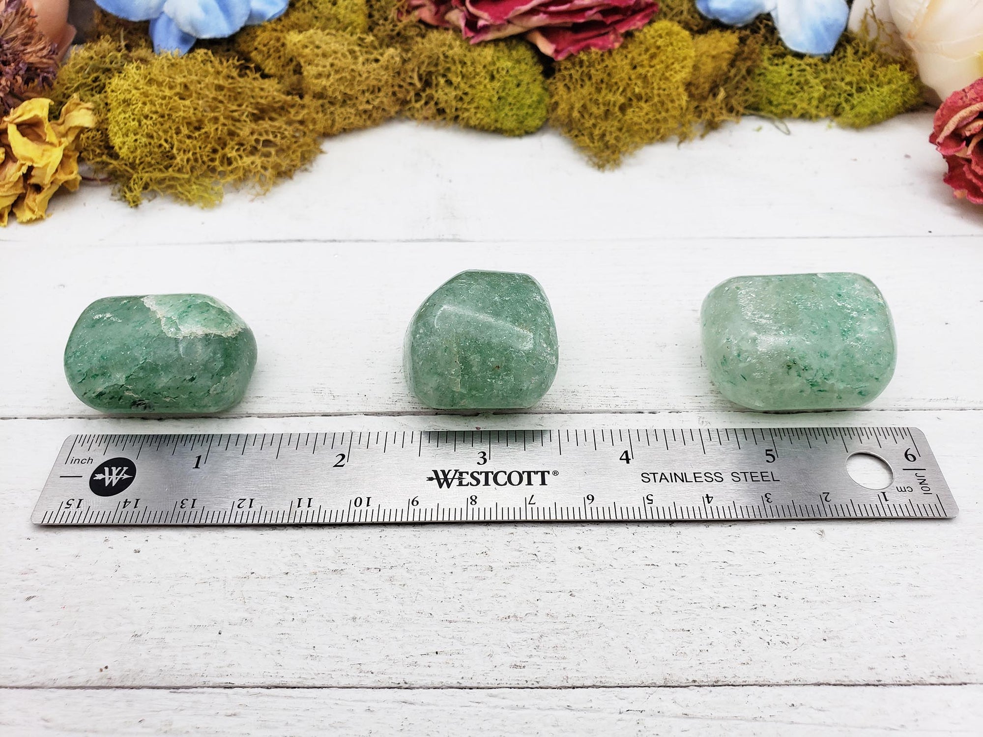 green included quartz crystal by ruler