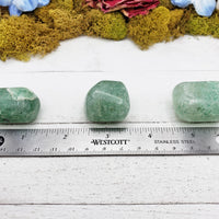 green included quartz crystal by ruler