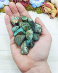 african turquoise stones in hand