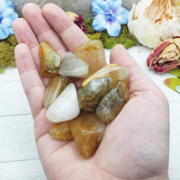Hematoid Gold Quartz Stones in hand