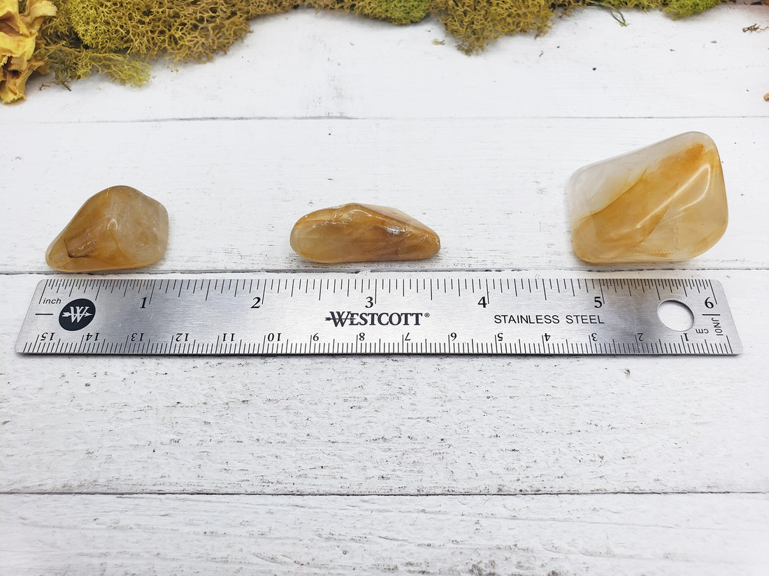 Hematoid Gold Quartz Stones by ruler