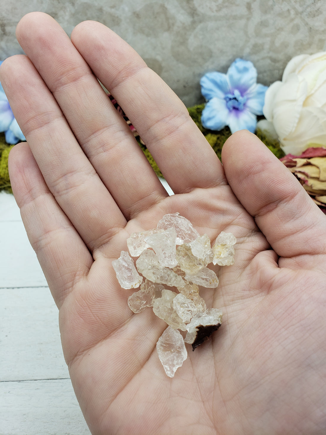 hand holding hyalite pieces