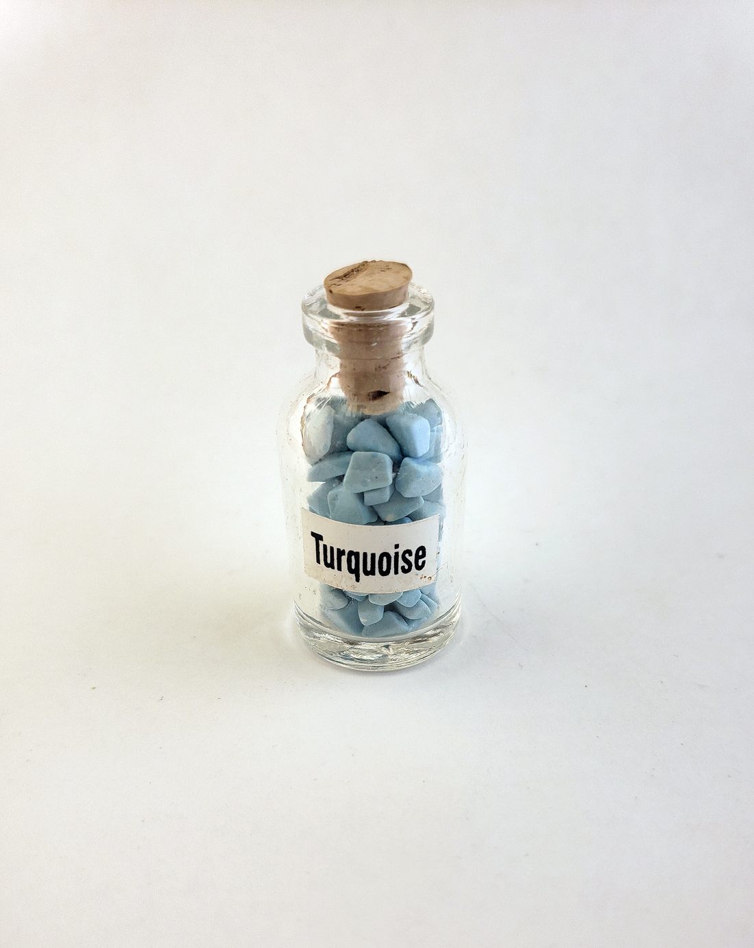 Imitation Turquoise Turquenite Blue Howlite Crystal Chips Bottle - One Bottle - On White Background