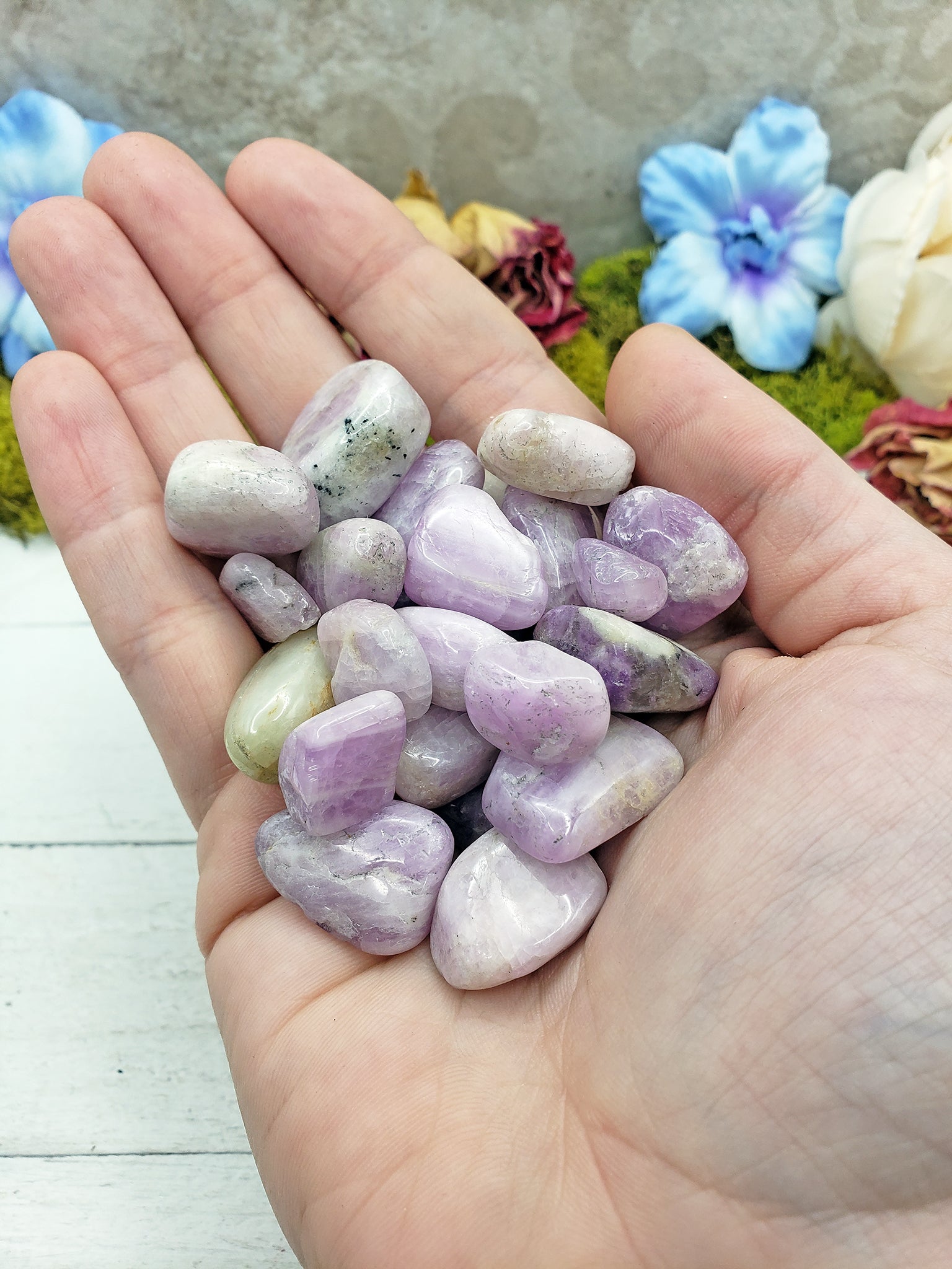 tumbled kunzite in hand